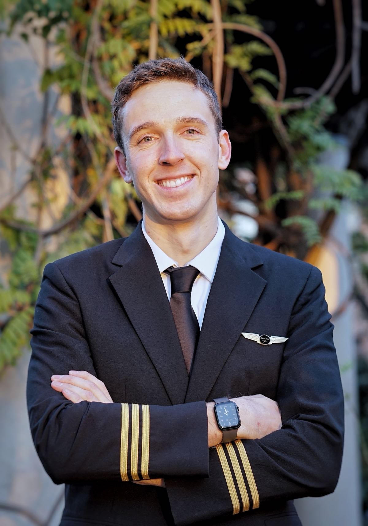 Daniel Sims in uniform, arms folded