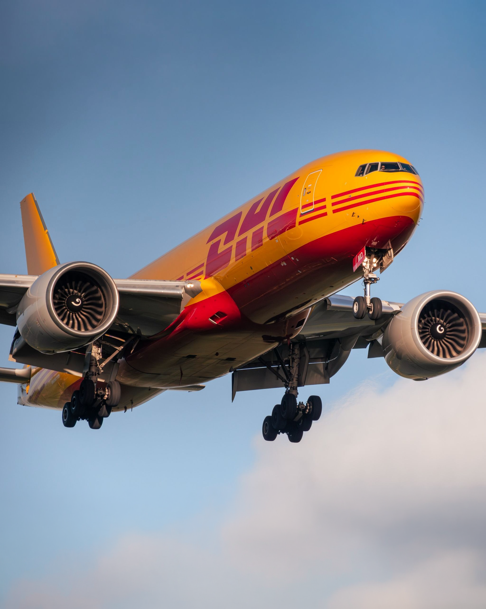 DHL Boeing 777 freighter on final approach, landing gear down